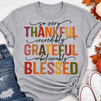 Thankful Grateful Blessed fall graphic crewneck tee with colorful autumn lettering
