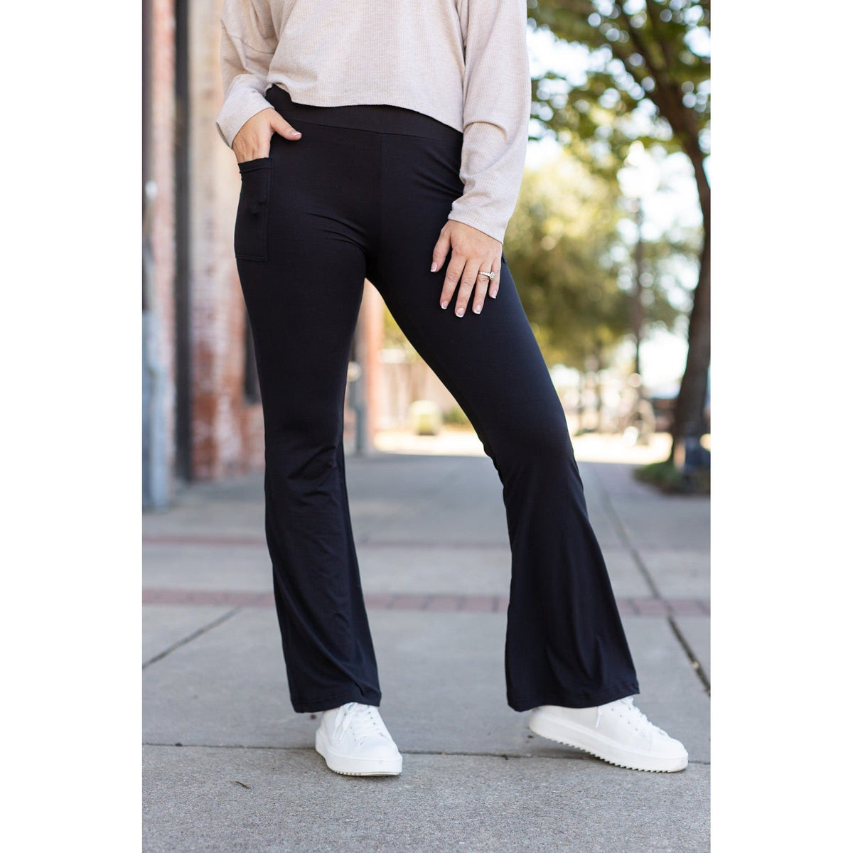 High-waisted black bootcut leggings by Julia Rose, Julia Rose women’s flared black leggings lifestyle image