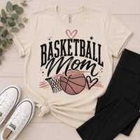 Neutral Basketball Mom crewneck T-shirt featuring a vintage basketball and hoop graphic with black stars and mauve heart accents.