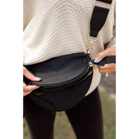 Women's sling bag with zipper closure and adjustable strap