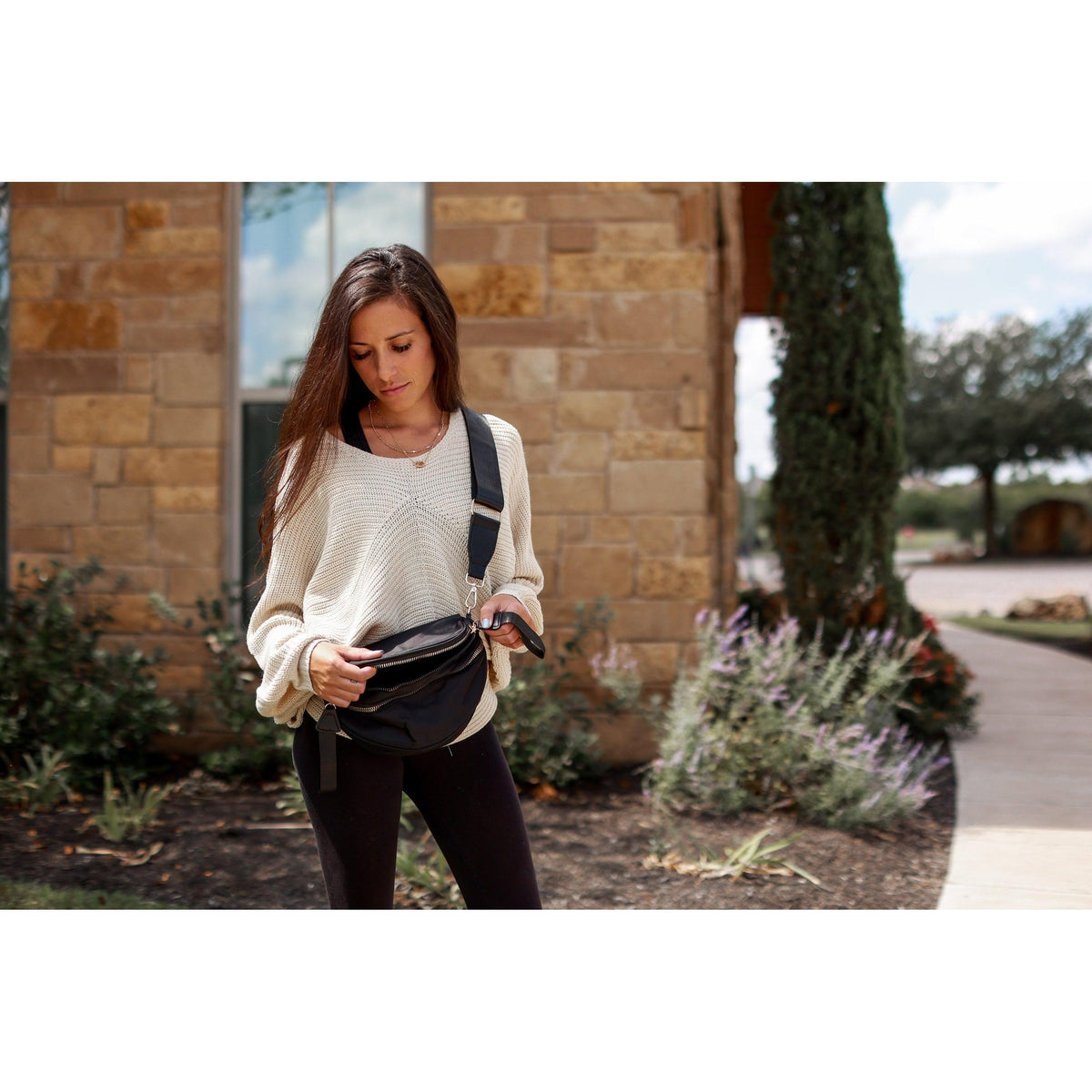 Women's sling bag with zipper closure and adjustable strap