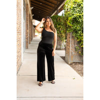 Women’s flowy velvet wide leg holiday pants. Velvet wide leg trousers styled for holiday outfits