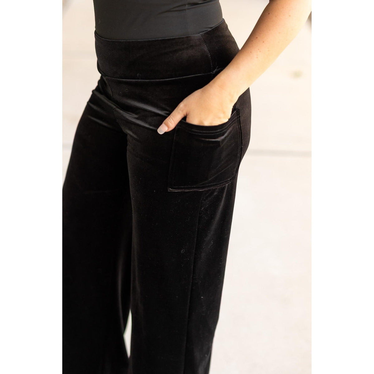 Women’s flowy velvet wide leg holiday pants. Velvet wide leg trousers styled for holiday outfits