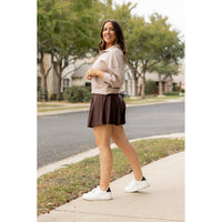 Stretchy brown Julia Rose skort styled for casual wear