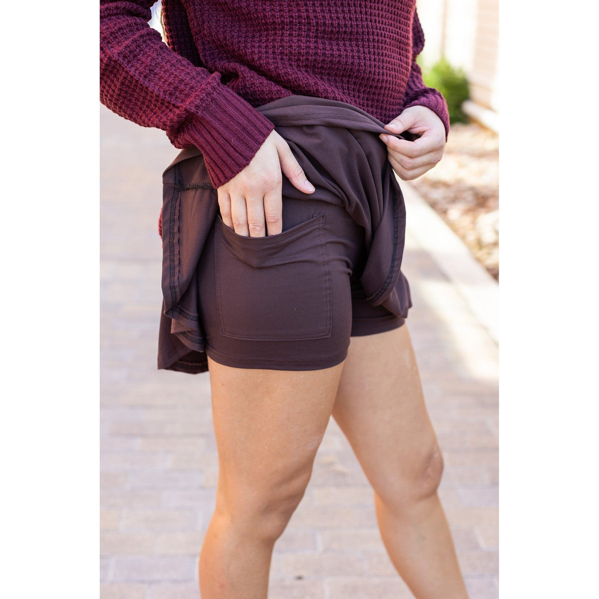 Stretchy brown Julia Rose skort styled for casual wear