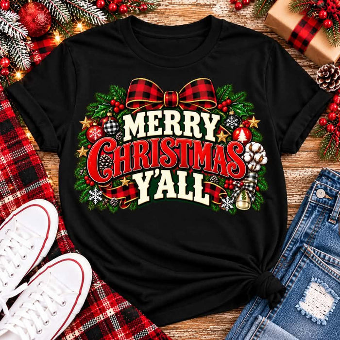 Merry Christmas Y'all graphic apparel featuring vintage red, green, and cream lettering with a festive buffalo plaid bow, Christmas ornaments, pine greenery, and rustic holiday decorations. Southern Christmas graphic available in two colors and four styles, including short sleeve crewneck, V-neck, long sleeve, and hoodie.