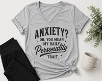 Gray graphic T-shirt with black vintage-style lettering reading Anxiety? Oh, You Mean My Daily Personality Trait.