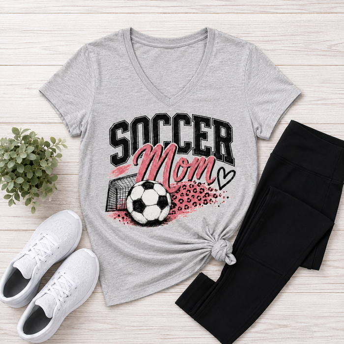 Gray V-neck Soccer Mom graphic tee with pink and black soccer ball, goal and leopard print design.