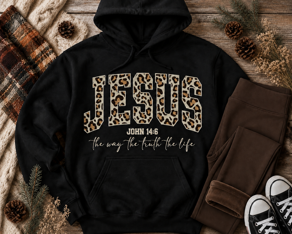 Black Jesus leopard-print John 14:6 pullover hoodie displayed with chocolate-brown fleece-lined leggings in a neutral fall and winter flat lay