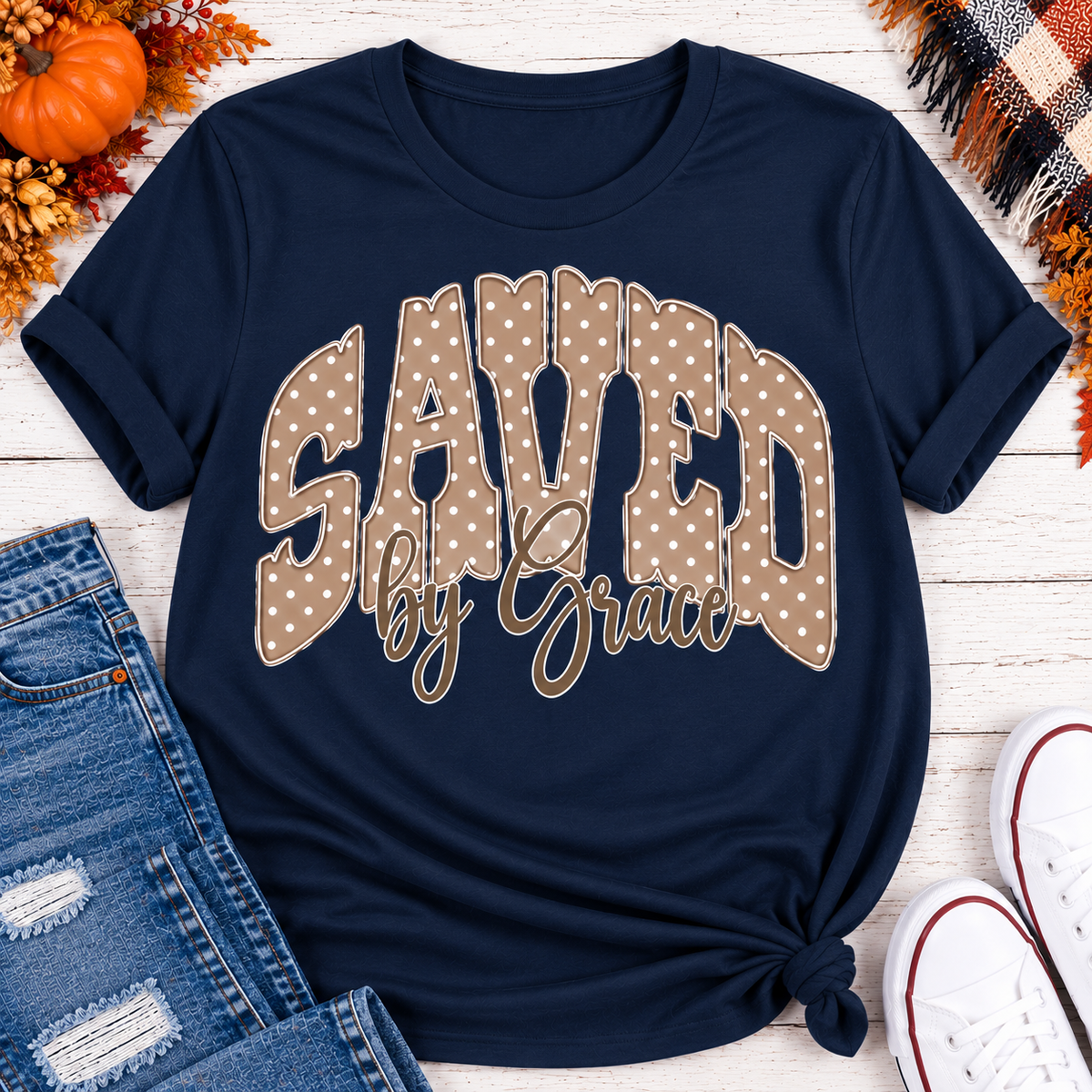 Saved by Grace faith graphic apparel with polka dot lettering, available in brown, navy and black V-neck, long sleeve, crewneck and hoodie styles.