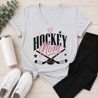 Heather gray v-neck Hockey Mom graphic tee featuring a black and pink hockey design styled with black leggings and white sneakers.