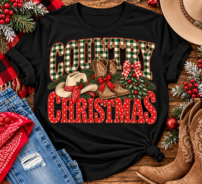 Country Christmas graphic tee with green plaid lettering, red polka dots, cowboy boots, western hat and festive Christmas bows.