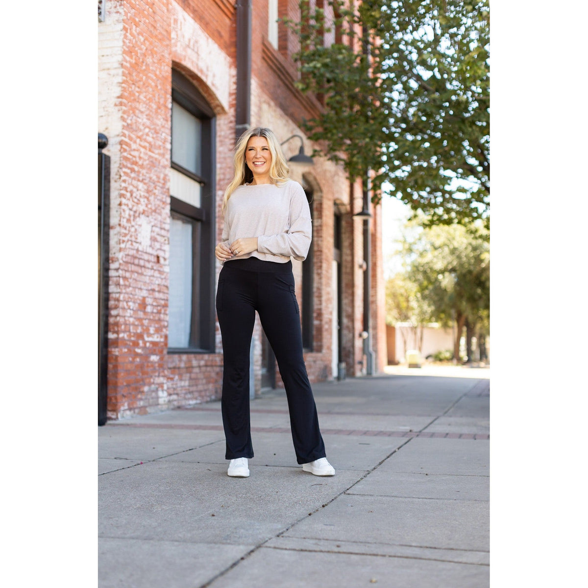High-waisted black bootcut leggings by Julia Rose, Julia Rose women’s flared black leggings lifestyle image