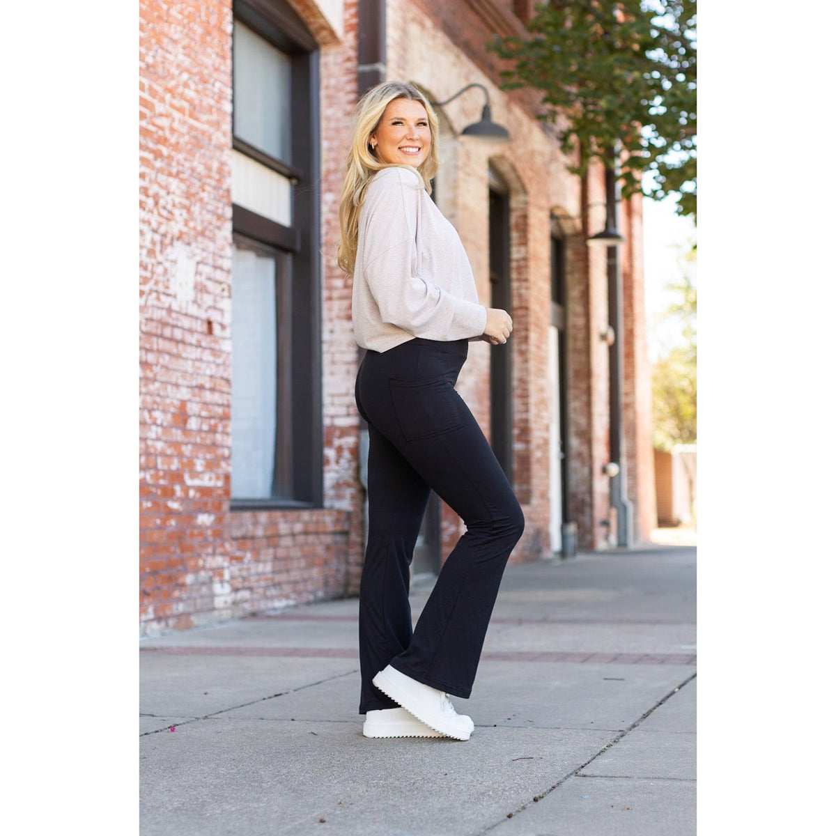 High-waisted black bootcut leggings by Julia Rose, Julia Rose women’s flared black leggings lifestyle image