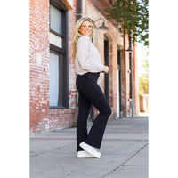 High-waisted black bootcut leggings by Julia Rose, Julia Rose women’s flared black leggings lifestyle image