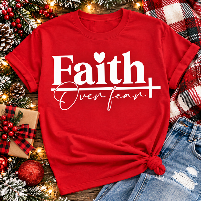 Faith Over Fear Christian inspirational graphic apparel featuring bold white Faith lettering, elegant Over Fear script, a small heart, and a cross design. Available in red and black in short sleeve crewneck, long sleeve crewneck, crewneck sweatshirt, and hoodie styles. Faith-based graphic clothing for women, everyday wear, church outfits, and inspirational gifts.