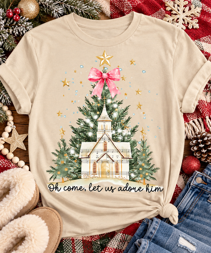 Oh Come Let Us Adore Him Christian Christmas graphic apparel with church, Christmas trees, stars and pink bow