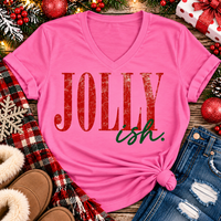 Jolly Ish Christmas graphic shirt featuring large distressed red JOLLY lettering with green handwritten ish script. Funny vintage-inspired holiday apparel available in pink and black, offered in short sleeve crewneck, V-neck, long sleeve and hoodie styles.