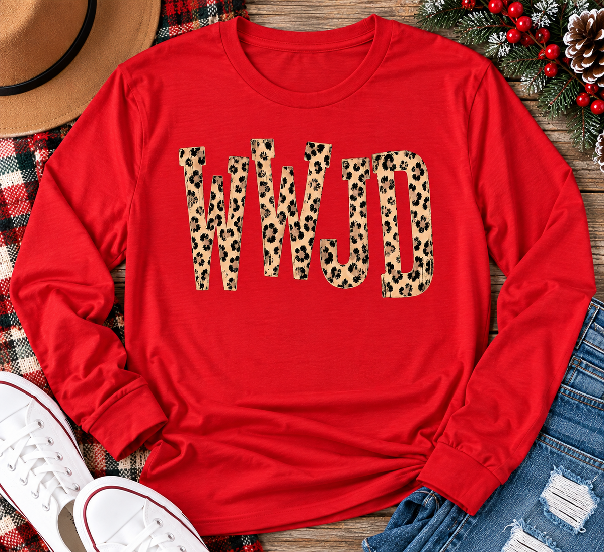 shirt with tan leopard-print WWJD lettering in a rustic holiday flat lay.