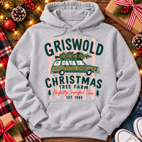 Christmas graphic tee featuring Griswold Christmas Tree Farm vintage green station wagon with Christmas tree and retro lettering.