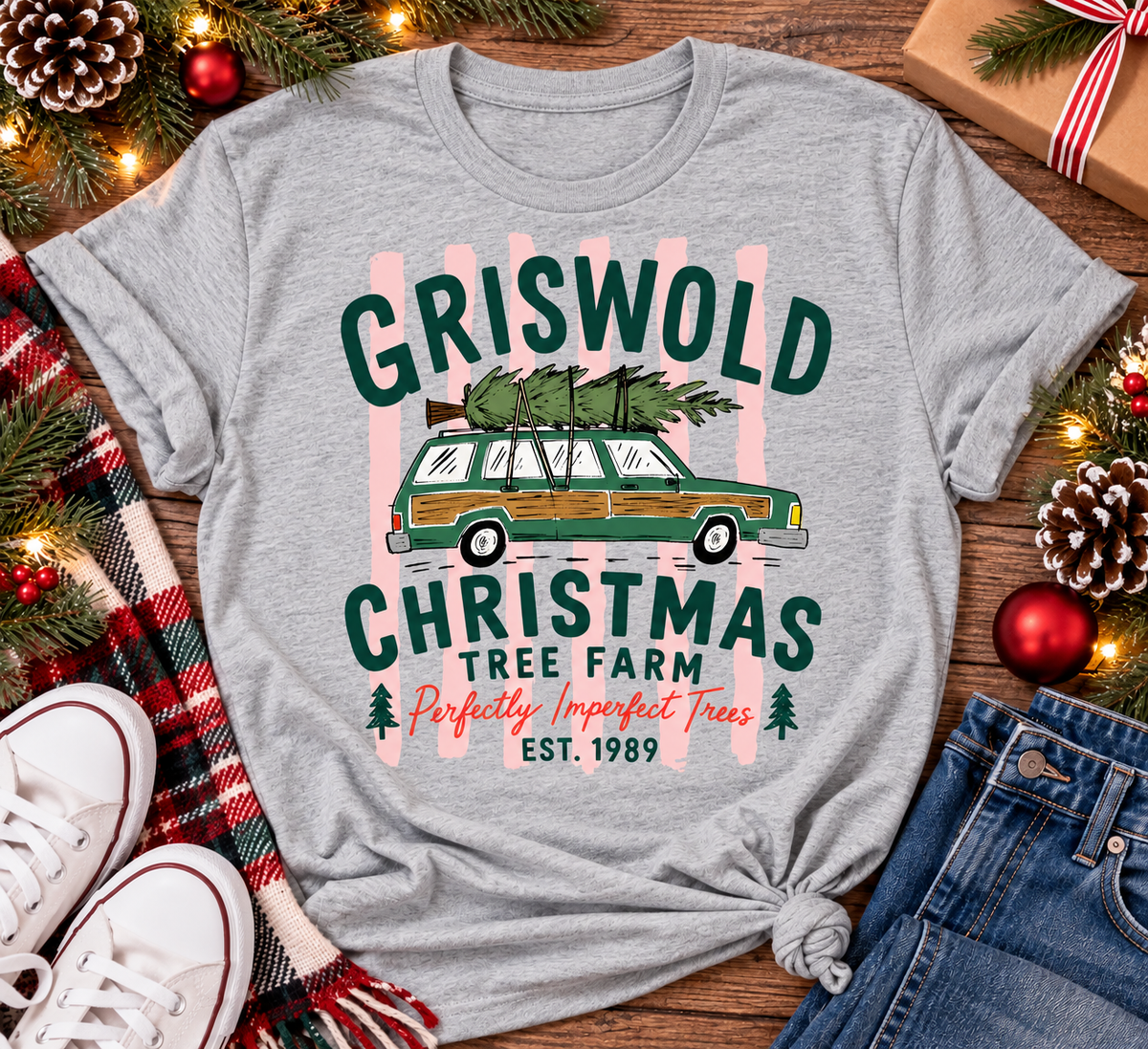 Christmas graphic tee featuring Griswold Christmas Tree Farm vintage green station wagon with Christmas tree and retro lettering.