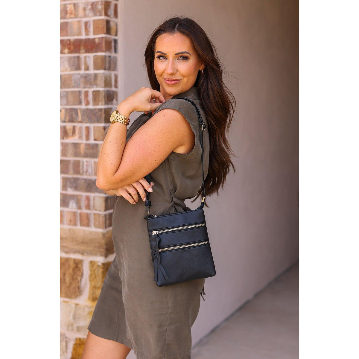 Envelope style crossbody bag with multiple zipper compartments
