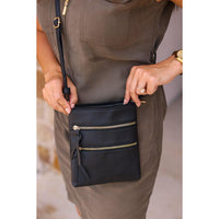 Envelope style crossbody bag with multiple zipper compartments