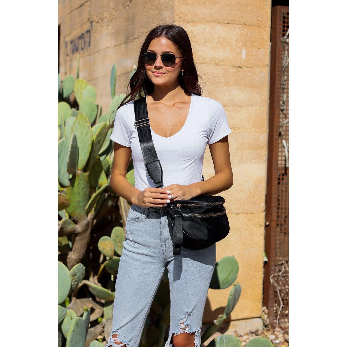 Women's sling bag with zipper closure and adjustable strap