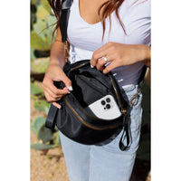 Women's sling bag with zipper closure and adjustable strap