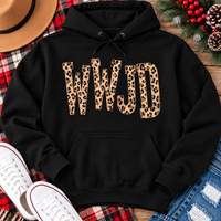 shirt with tan leopard-print WWJD lettering in a rustic holiday flat lay.