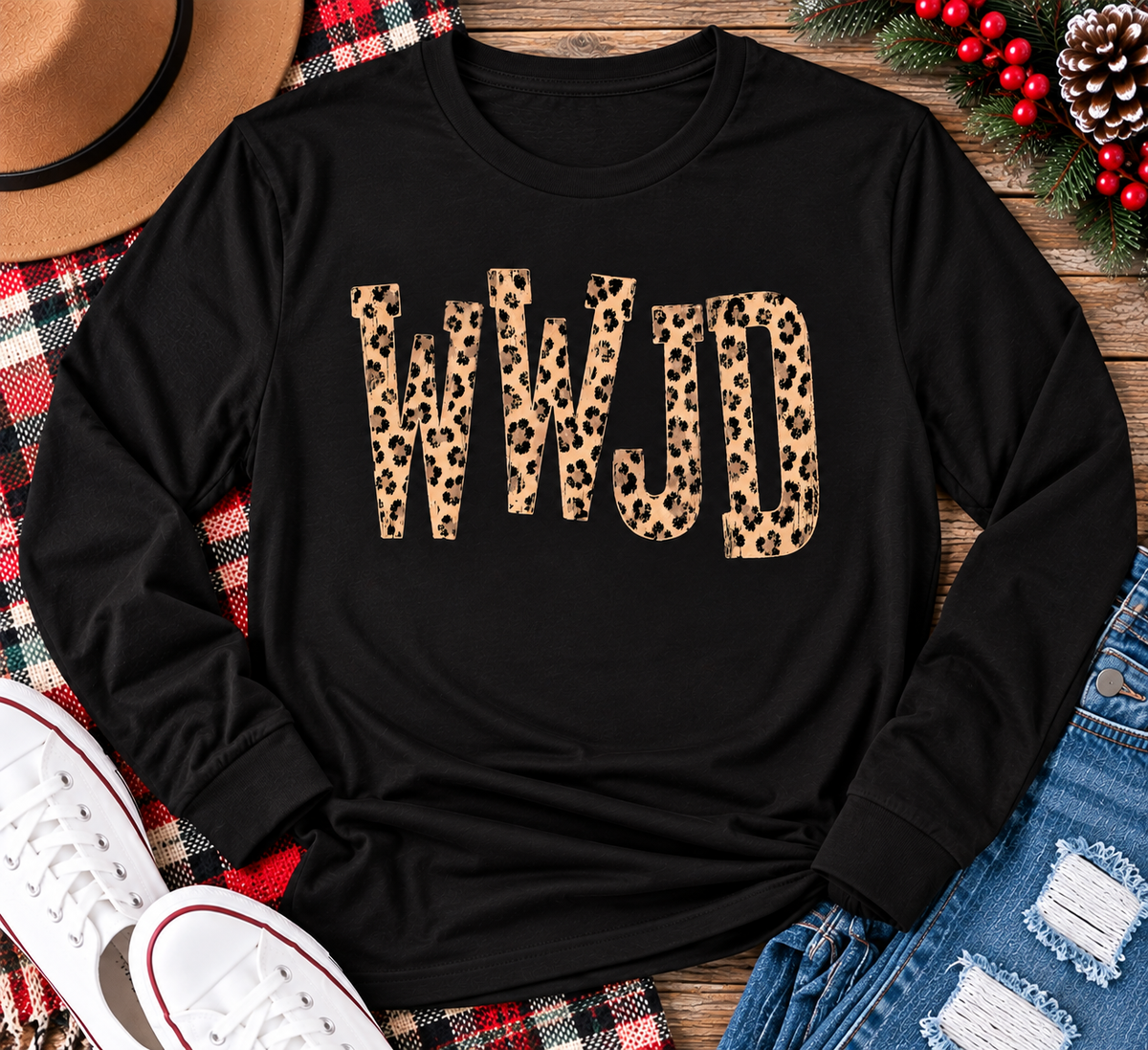 shirt with tan leopard-print WWJD lettering in a rustic holiday flat lay.
