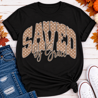 Saved by Grace faith graphic apparel with polka dot lettering, available in brown, navy and black V-neck, long sleeve, crewneck and hoodie styles.