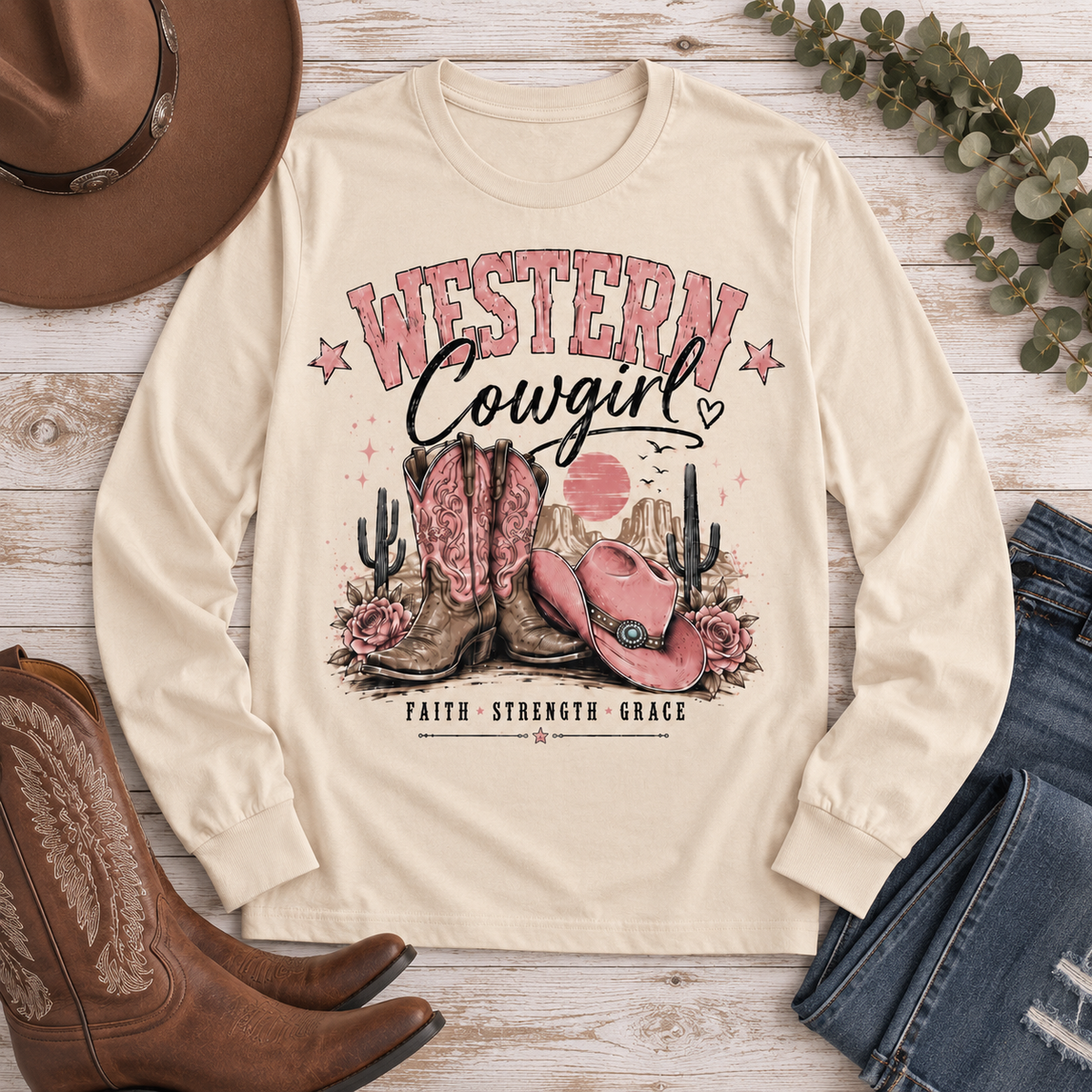 Western Cowgirl graphic long sleeve crewneck tee with pink boots, cowboy hat and desert design
