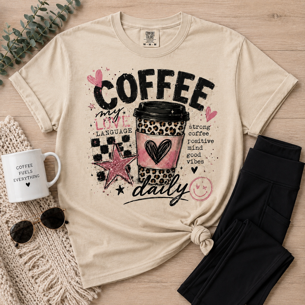 Cream Coffee My Love Language graphic tee featuring a pink and leopard print coffee cup, black checkerboard pattern, hearts, stars and Strong Coffee Positive Mind Good Vibes text.