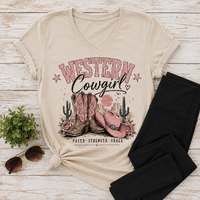 Western Cowgirl graphic V-neck tee featuring pink cowboy boots, hat and western desert design