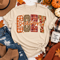 Cream crewneck Cozy Season fall graphic tee with plaid, leopard and autumn print lettering