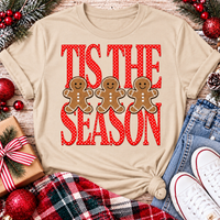 Tis the Season Christmas graphic apparel featuring red polka dot lettering and three gingerbread cookies