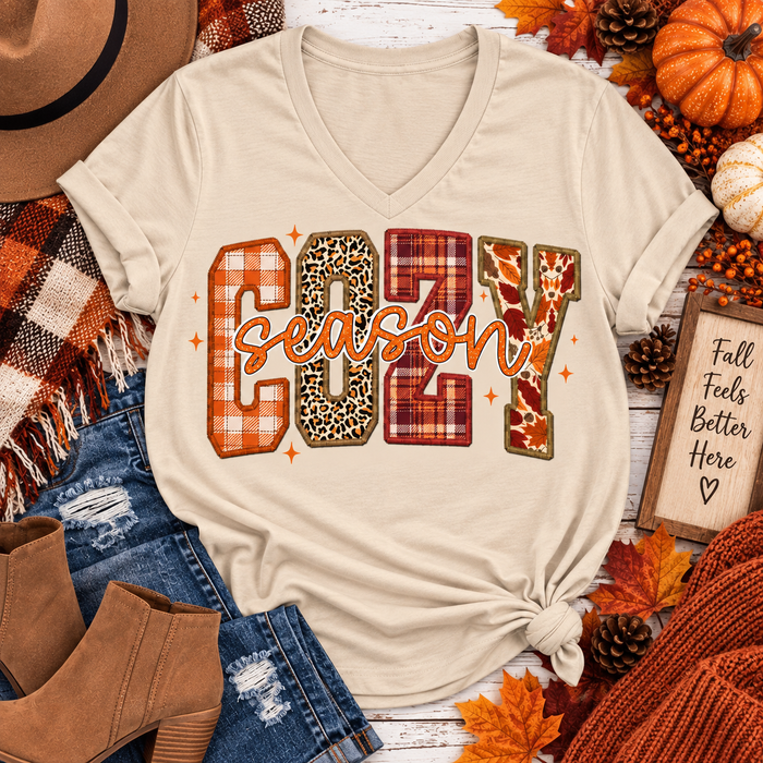 Cream V-neck Cozy Season fall graphic tee featuring plaid, leopard and leaf print design