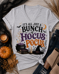 Hocus Pocus Halloween graphic V-neck tee with witch hat, cauldron and spell books