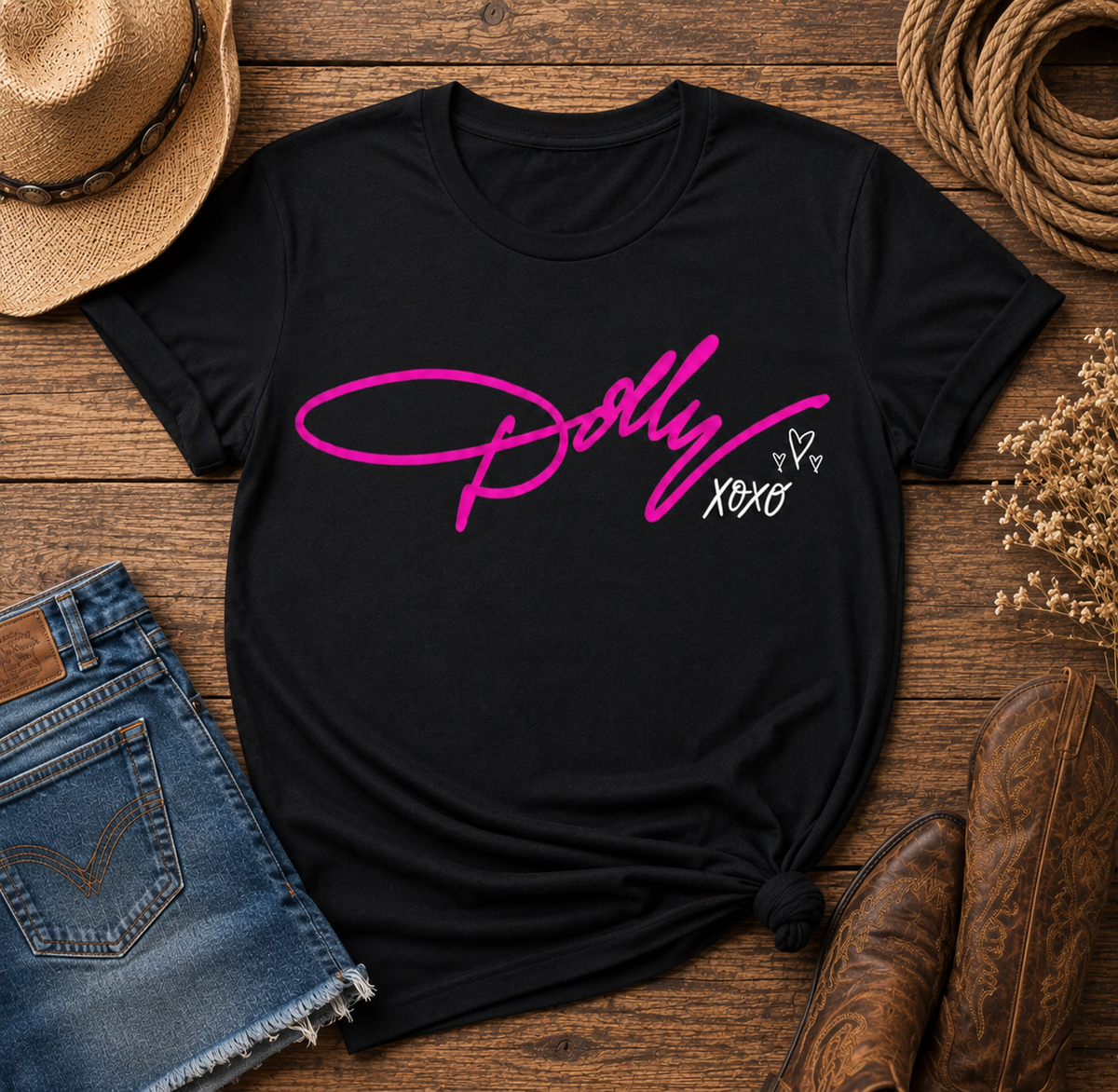Black Dolly tribute graphic T-shirt featuring bright pink Dolly script with white XOXO and heart details.