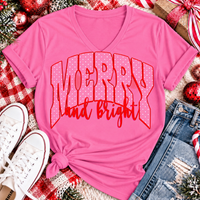 Merry and Bright Christmas graphic apparel with oversized pink polka dot lettering and festive holiday design