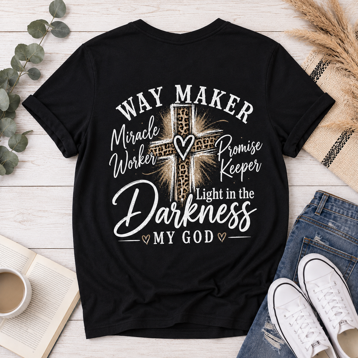 Black V-neck tee with God heart front graphic and Way Maker leopard cross faith graphic on back