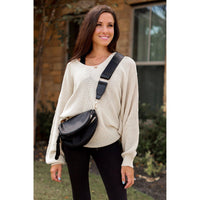 Women's sling bag with zipper closure and adjustable strap