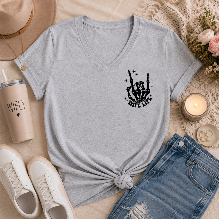 Gray v-neck graphic tee featuring a small black skeleton hand and “Wife Life” design on the front chest.